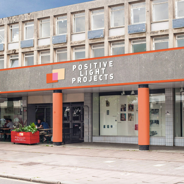 An image of a building on Sidwell Street with the words Positive Lights Project above the door.