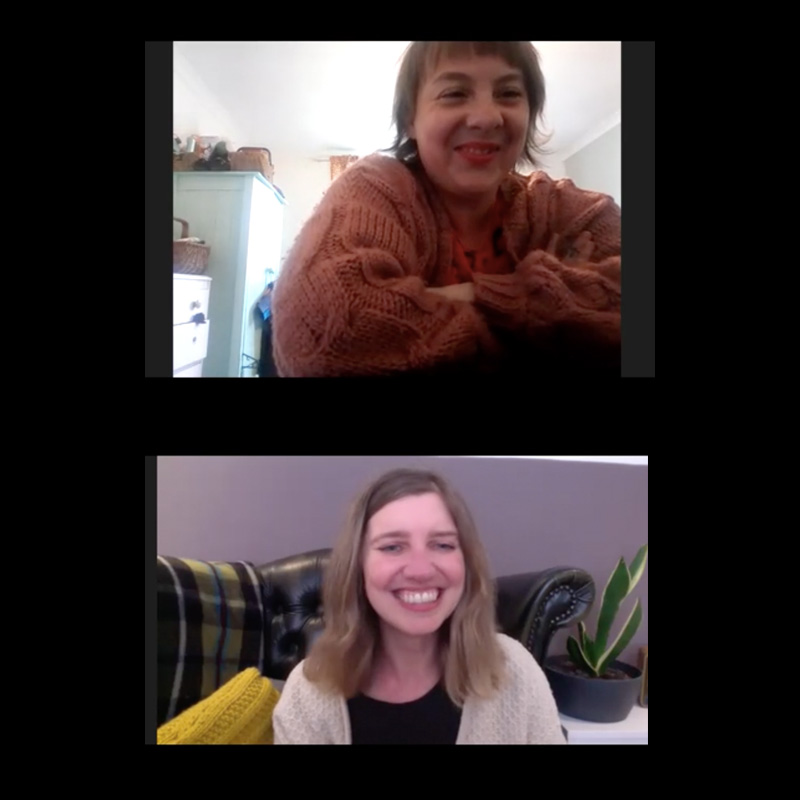 A screenshot of a zoom conversation between two women, smiling to each other.