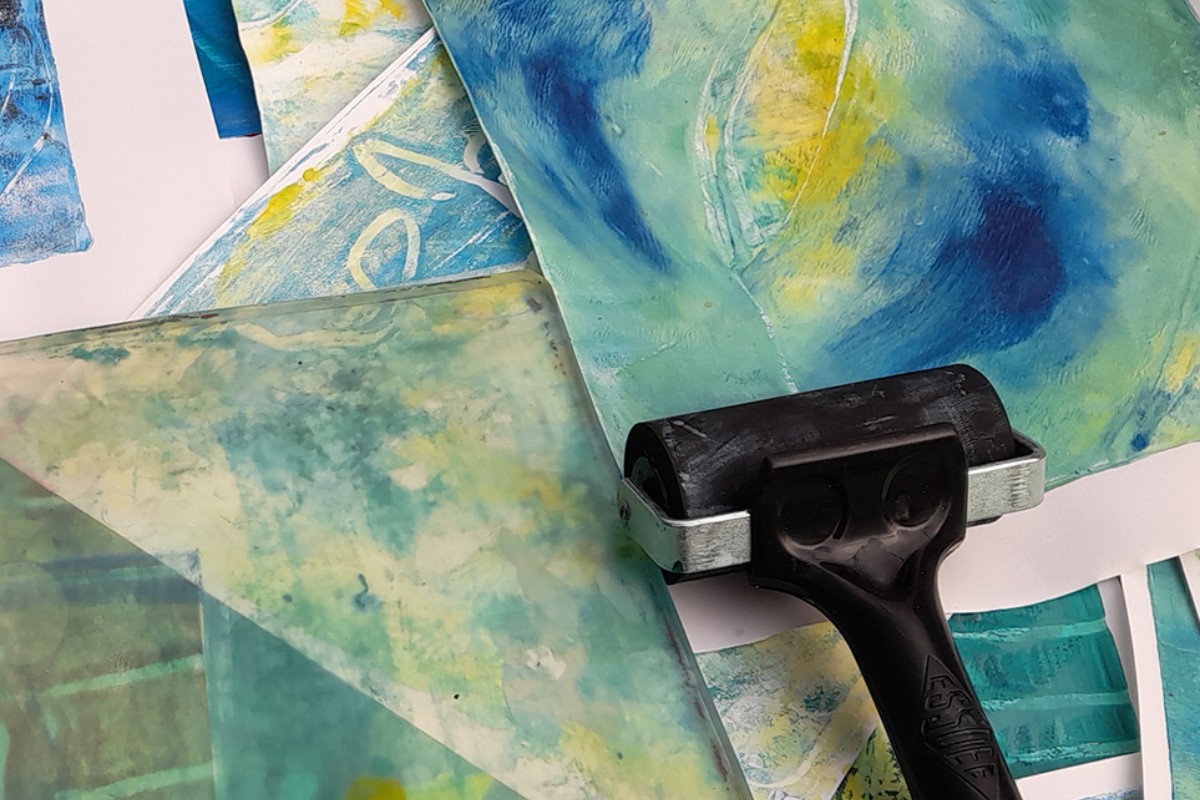 A print roller and blue inks on a gelli plate